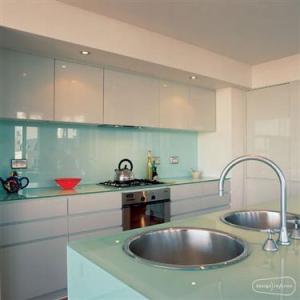 Glass cupboards, backsplash and countertops in kitchen